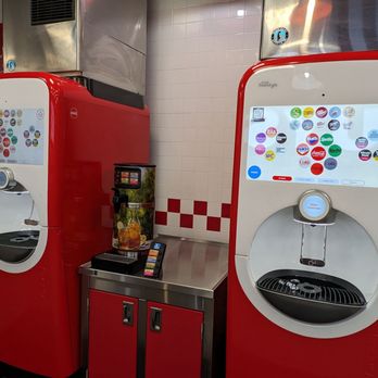 Five Guys - a row of vending machines in a restaurant - Burgers Near Me - Indianapolis, Indiana