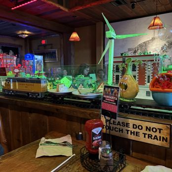 Buffalo Phil's Pizza & Grille - Train coming by, blowing bubbles - American Near Me - Wisconsin Dells, Wisconsin Buffalo Phil's Pizza & Grille - Train coming by, blowing bubbles - American Near Me - Wisconsin Dells, Wisconsin