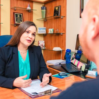 County Line Chiropractic - Dr. Vivian Solivan going over treatment plan with patient - Chiropractors Near Me - Fort Lauderdale, Florida County Line Chiropractic - Dr. Vivian Solivan going over treatment plan with patient - Chiropractors Near Me - Fort Lauderdale, Florida