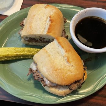 The Stable Inn - French dip sandwich (he got soup for his side, which is not pictured). All burgers and sandwiches come with a pickle. - American Near Me - Grand Haven, Michigan The Stable Inn - French dip sandwich (he got soup for his side, which is not pictured). All burgers and sandwiches come with a pickle. - American Near Me - Grand Haven, Michigan