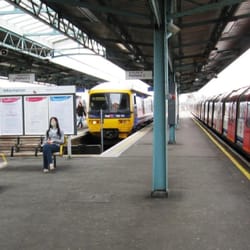 Greenford Underground Station - A Central Line train for West Ruislip on the right passes a Great Western train just arrived from Paddington.