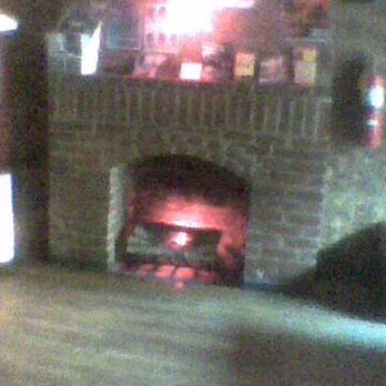 Nowhere - electric fireplace near the front of the bar - Gay Bars Near Me - New York, New York