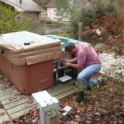 Hot Tub and Spa Movers - Unwiring a Leisure Bay Hot Tub in Cary, NC. Preparing for transport to new home.