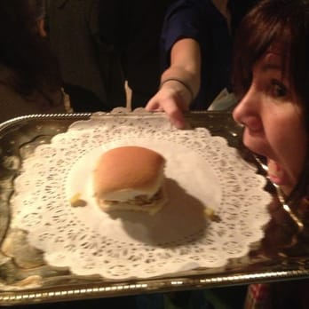 Happy's Place - a woman holding a tray with a sandwich on it - Pizza Near Me - Dubuque, Iowa Happy's Place - a woman holding a tray with a sandwich on it - Pizza Near Me - Dubuque, Iowa