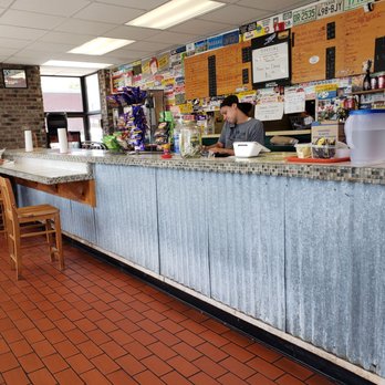Sub Stop - two people sitting at a counter - Sandwiches Near Me - Wilmington, North Carolina Sub Stop - two people sitting at a counter - Sandwiches Near Me - Wilmington, North Carolina