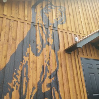 Roof Hound - a dog painted on the side of a building - Breweries Near Me - Hillgrove, Nova Scotia