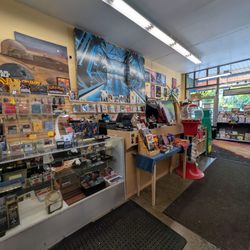 Other Worlds Games - Cashier and inside the store