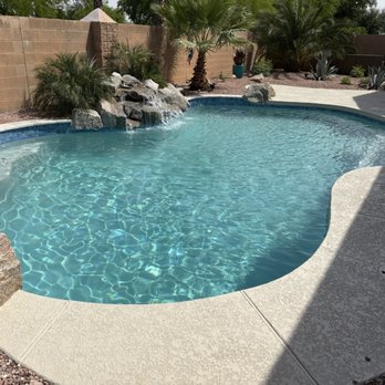 Garza Pools - After- New decking, travertine cap, tile and pebble coating. - Pool & Hot Tub Service Near Me - Litchfield Park, Arizona Garza Pools - After- New decking, travertine cap, tile and pebble coating. - Pool & Hot Tub Service Near Me - Litchfield Park, Arizona