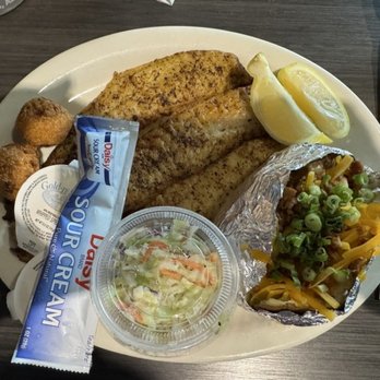 Doc's Seafood & Steaks - Fish filet (blackened), loaded baked potato along, cole slaw, hush puppies - Seafood Near Me - Orange Beach, Alabama
