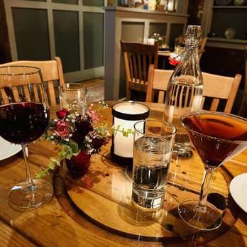 Rye Tavern - a wooden table with wine glasses and plates - Cocktail Bars Near Me - Plymouth, Massachusetts Rye Tavern - a wooden table with wine glasses and plates - Cocktail Bars Near Me - Plymouth, Massachusetts
