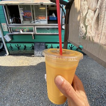 Sizzling Tandoori Hut - a hand holding a drink - Indian Near Me - Aurora, Oregon Sizzling Tandoori Hut - a hand holding a drink - Indian Near Me - Aurora, Oregon