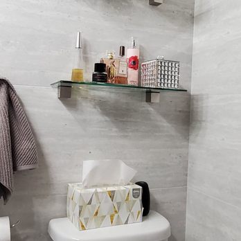 Sopling - a bathroom with a toilet and shelves - Flooring Near Me - Canoga Park, California Sopling - a bathroom with a toilet and shelves - Flooring Near Me - Canoga Park, California