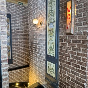 Cafe Du Louvre - The stairs down to the restroom - French Near Me