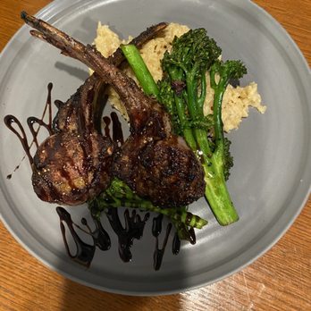 Peasant Village Restaurant - Rack of Lamb served with Risotto and Broccolini - New American Near Me - San Angelo, Texas Peasant Village Restaurant - Rack of Lamb served with Risotto and Broccolini - New American Near Me - San Angelo, Texas