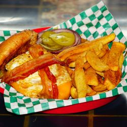 Huevos Burger: Flame grilled and topped with crispy bacon, fried egg and melted cheddar cheese.