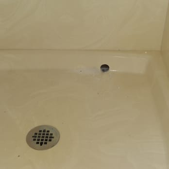 M & M Electric - This is the hole that one of Marcus' employees drilled through our shower stall by accident.. - Electricians Near Me - Brentwood, California