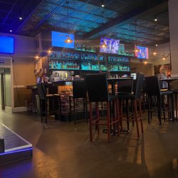 Whiskey’s Bar & Lounge - Bar area ( booths are to the left, high tops and bar seating)
