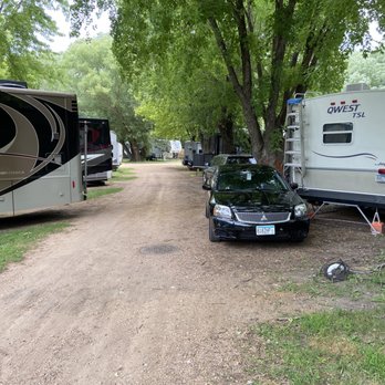 Minneapolis Southwest KOA - The road we would've had to make a turn from, with ride lady's car blocking part of the drive. - RV Parks Near Me - Jordan, Minnesota