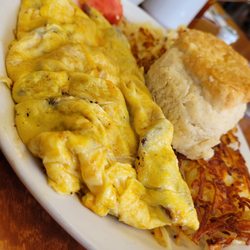 Joyce & Co. Cafe - Meat lovers omelet with homemade biscuit.