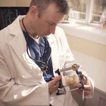 DurhamDDS - Dr. Bill Argersinger evaluating a complex patient case at DurhamDDS in Durham, NC. - Cosmetic Dentists Near Me - Durham, North Carolina DurhamDDS - Dr. Bill Argersinger evaluating a complex patient case at DurhamDDS in Durham, NC. - Cosmetic Dentists Near Me - Durham, North Carolina