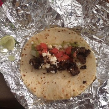 Taco John's - a tortilla wrapped in aluminum foil - Mexican Near Me - Lawrence, Kansas