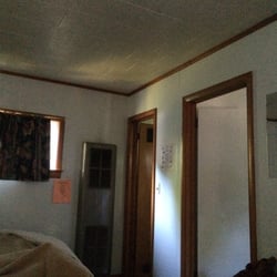 Hulbert Hills Motel - Main room with door to bathroom and bedroom.
