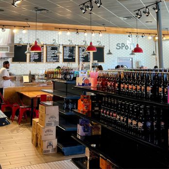 SPoT! - the inside of a restaurant with a variety of beverages - Bagels Near Me - Norwood, Massachusetts