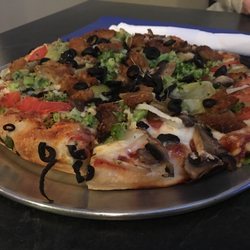 DB's Pizza - Veggie deluxe, no peppers added artichoke hearts. SO good!!!