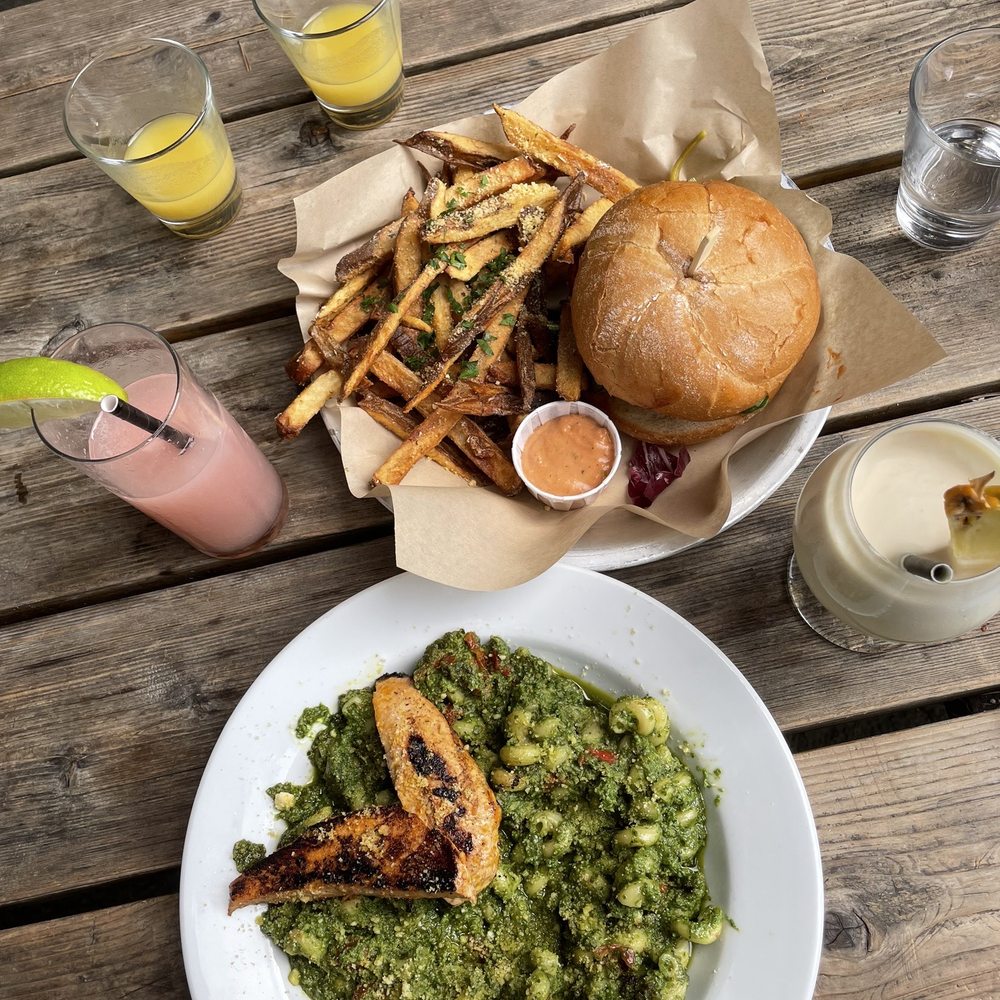 a plate of food on a picnic table a plate of food on a picnic table