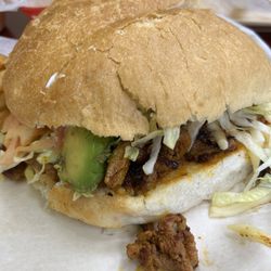 Torta Al pastor with avocado