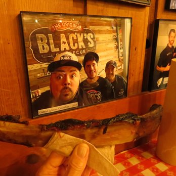 Black's Barbecue Lockhart - Even Fluffy is amazed at the size of this rib! - Barbeque Near Me - Lockhart, Texas