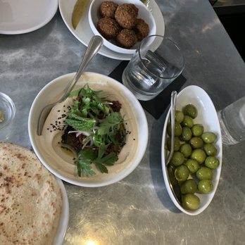 Mediterranean Exploration - Warm (!) olives, hummus with lamb crispies, and falafel - Mediterranean Near Me - Portland, Oregon