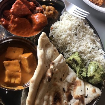 Bombay Chaat - Lunch buffet! Clockwise from top: butter chicken, pulao rice, a garlic cilantro chicken, fresh naan, paneer masala - Indian Near Me - Cleveland, Ohio Bombay Chaat - Lunch buffet! Clockwise from top: butter chicken, pulao rice, a garlic cilantro chicken, fresh naan, paneer masala - Indian Near Me - Cleveland, Ohio