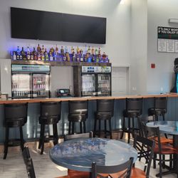 The Oasis Hotel & Bar - Fully stocked bar currently open from 5pm - 11pm everyday!