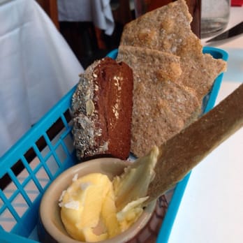 Svartengrens - Bread served with the dinner. The tiny loaf of dark bread was delicious! The plastic basket felt completely out of place though. - Brasseries Near Me - Stockholm, Alberta