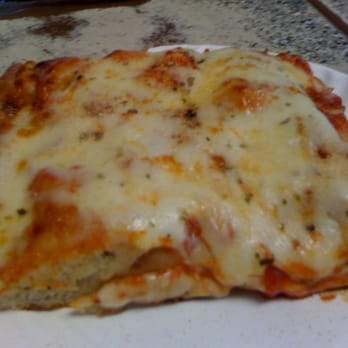 Tony's Pizzeria - a slice of pizza on a paper plate - Pizza Near Me - Brooklyn, New York Tony's Pizzeria - a slice of pizza on a paper plate - Pizza Near Me - Brooklyn, New York