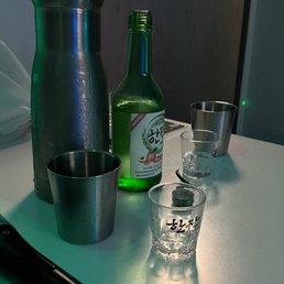 Doremi Karaoke - a baseball bat, shot glasses and a bottle - drink - Karaoke Near Me - Eagan, Minnesota
