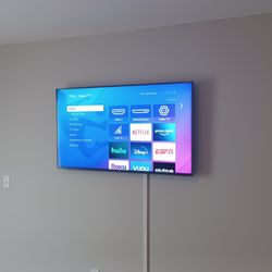 BroadTasking - Mounted a TV in a bedroom with cable covers to conceal the cables