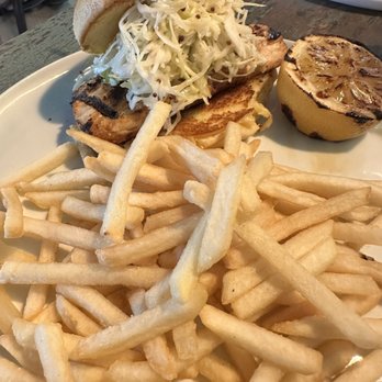 The Spring on Main - Mahi-mahi sandwich and fries. - New American Near Me - Eureka Springs, Arkansas The Spring on Main - Mahi-mahi sandwich and fries. - New American Near Me - Eureka Springs, Arkansas