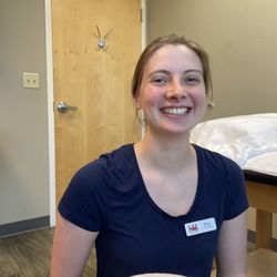 Husker Rehab - South Lincoln - This is Olivia! She is a physical therapy tech and so much more. She is full of life with an award-winning smile.
