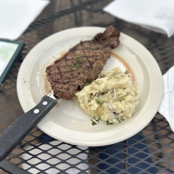 Paddy's Irish Pub - 8 oz. New York Strip Steak and mashed potatoes - Irish Near Me - Charles Town, West Virginia Paddy's Irish Pub - 8 oz. New York Strip Steak and mashed potatoes - Irish Near Me - Charles Town, West Virginia