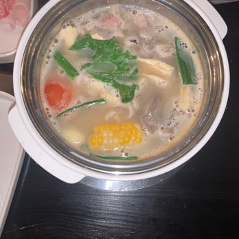 JBBQ and Shabu Shabu - Hot Pot cooking. To the right is the ultra-tasty seasoned soy sauce - Japanese Near Me - Bay Shore, New York JBBQ and Shabu Shabu - Hot Pot cooking. To the right is the ultra-tasty seasoned soy sauce - Japanese Near Me - Bay Shore, New York