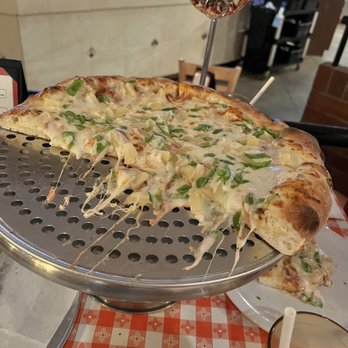 Gianni's Pizza - We meant to take a picture of the entire pizza, but we were too busy eating it because it was so delicious - Italian Near Me - Monterey, California