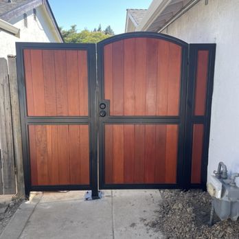 Volt Automatic Gates - Custom swing gate with black steel frame and redwood-style composite panels - combining strength with elegant curb appeal. - Fences & Gates Near Me - San Jose, California