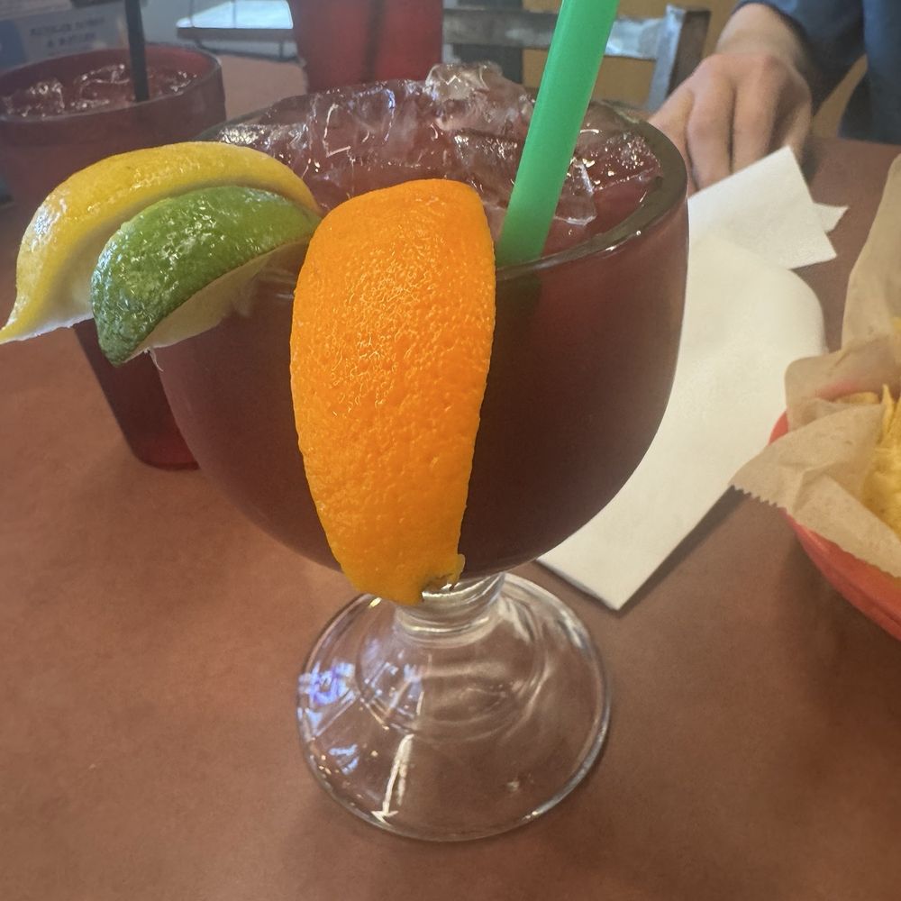 El Columpio - Sangria garnished with beautiful lemon, lime, and orange. - Mexican Near Me - Mitchell, South Dakota El Columpio - Sangria garnished with beautiful lemon, lime, and orange. - Mexican Near Me - Mitchell, South Dakota