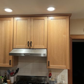 Fresh Face Cabinet Refacing - Upper cabinets in rift sawn red oak. - Cabinetry Near Me