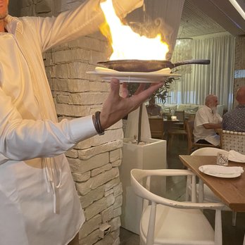 Thasos - Saganaki flaming kefalograviera cheese - Greek Near Me - Fort Lauderdale, Florida