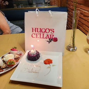 Hugo's Cellar - Chocolate covered fruit along with special birthday dessert - American Near Me - Las Vegas, Nevada