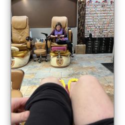 LiLi Nails - Lili who rushed through  my pedicure then sat on her phone.