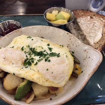 First Watch - Skillet Hash - Farmhouse:  eggs over easy, seasoned potatoes, house-roasted onions and tomatoes, cheese and avocado with toast and fruit - Breakfast & Brunch Near Me - Bowie, Maryland